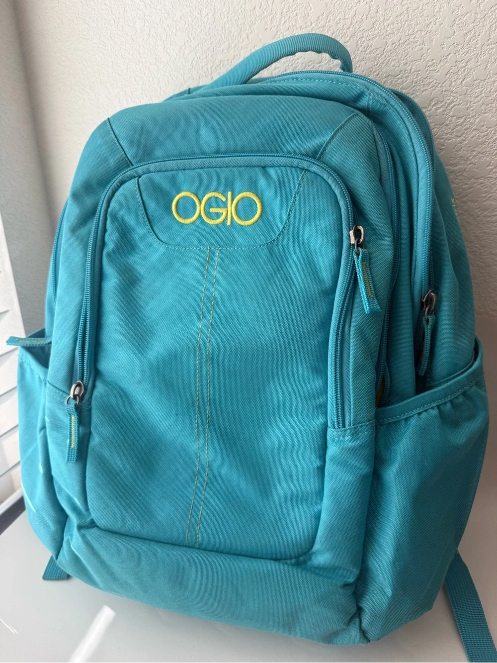 OGIO Aqua Blue Backpack with Yellow Logo